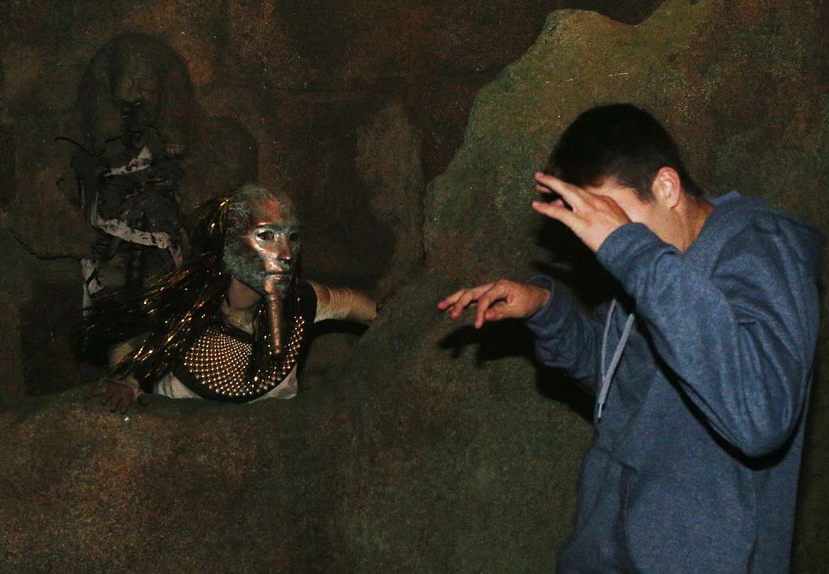An actor pops around the corner to scare Daniel Mckeirnan as he makes his way through the Valley of the Queens section of Silverwood&#146;s new Scarywood attraction Pharaoh&#146;s Curse.