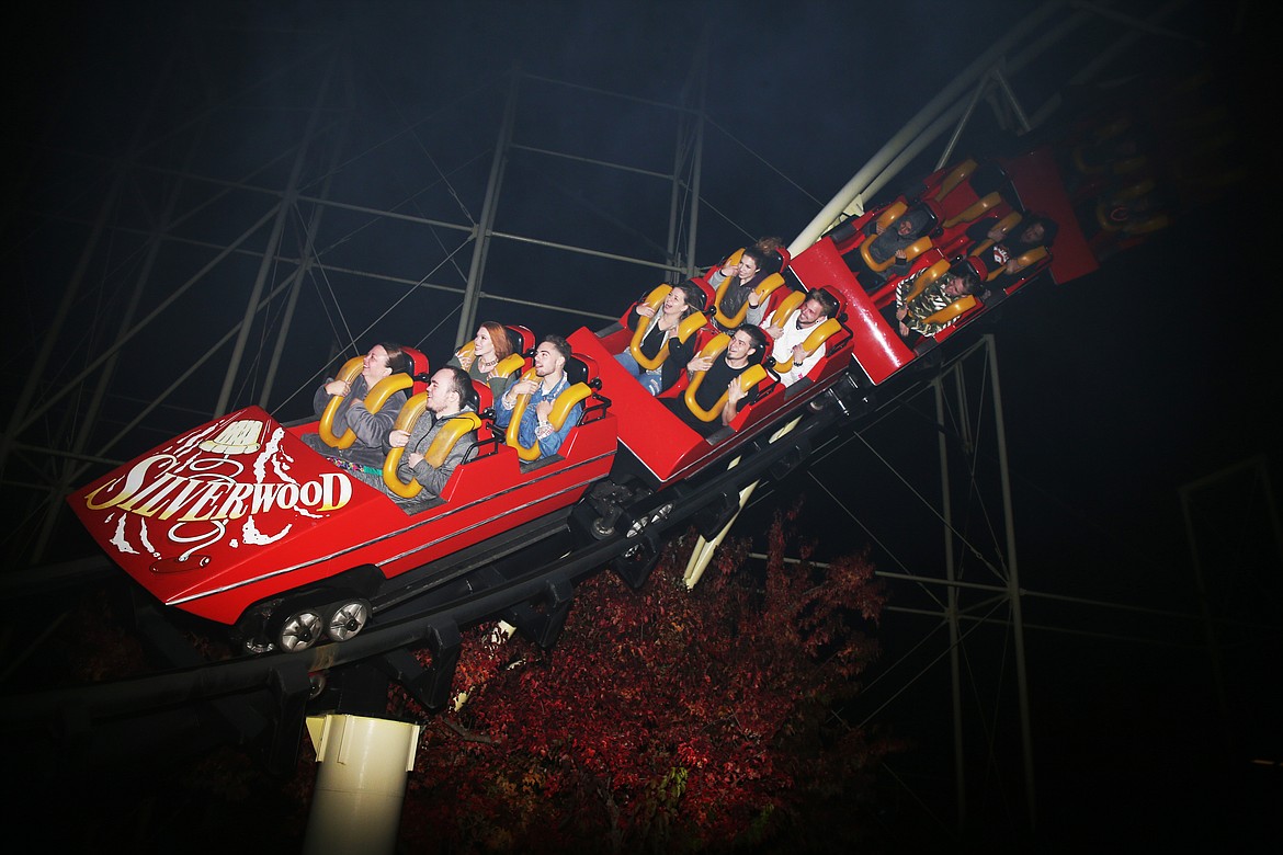 Guests ride the Corkscrew rollercoaster during opening night Friday night at Scarywood. LOREN BENOIT/Press