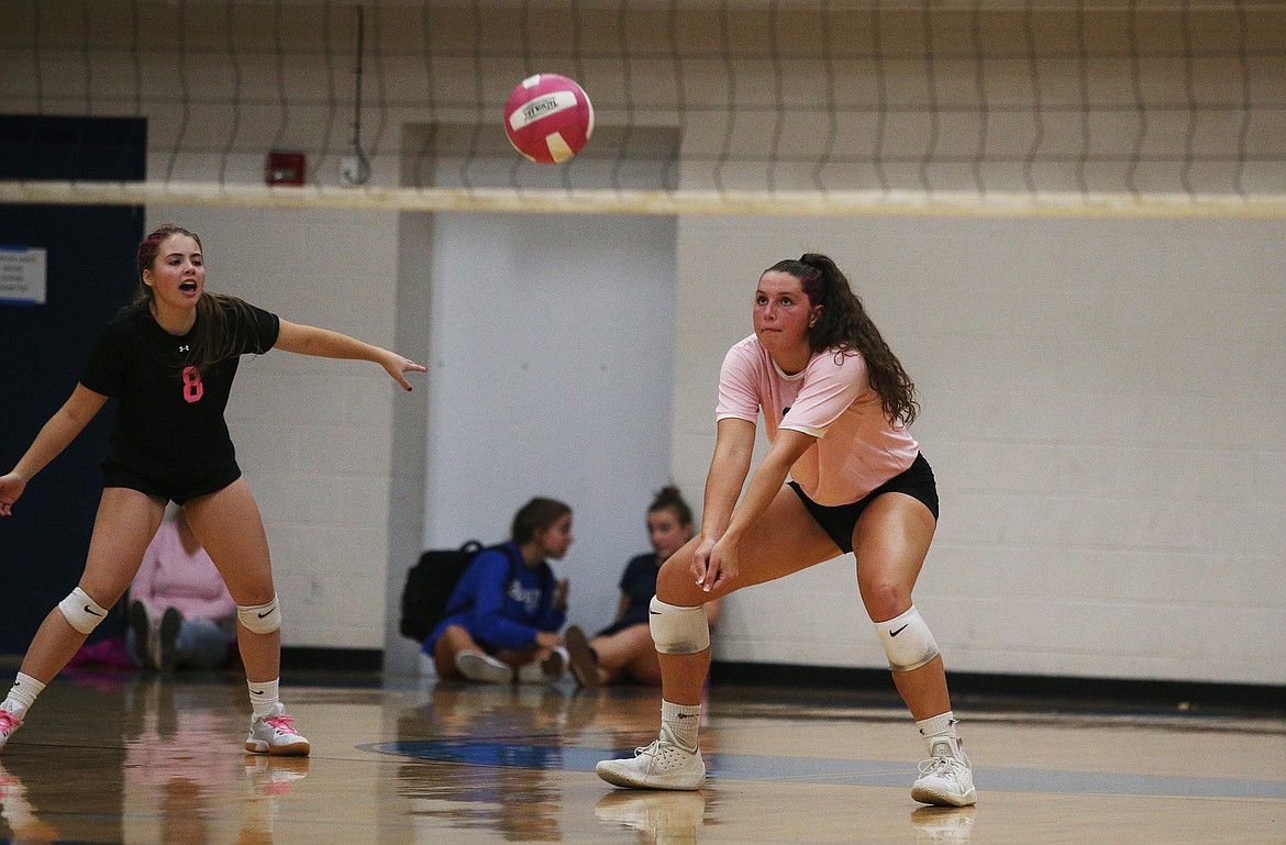Coeur d&#146;Alene High outside hitter Kelly Horning hits a Post Falls serve to a teammate in Thursday&#146;s Volleyball for the Cure match at Coeur d&#146;Alene High. (LOREN BENOIT/Press)