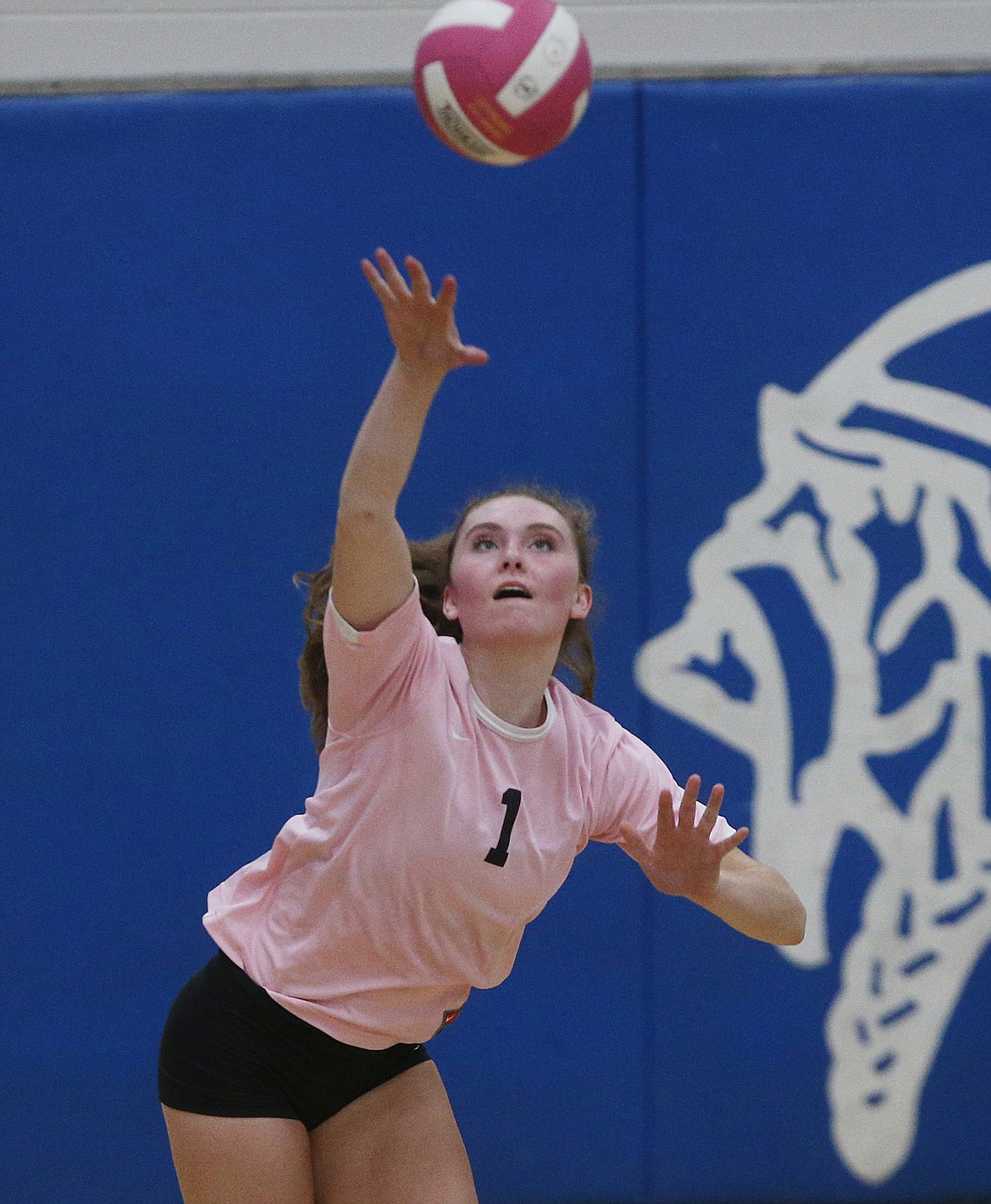 Coeur d&#146;Alene High&#146;s Lauren Phillips serves the volleyball to Post Falls in the Volleyball for the Cure match on Thursday at Coeur d&#146;Alene High. (LOREN BENOIT/Press)