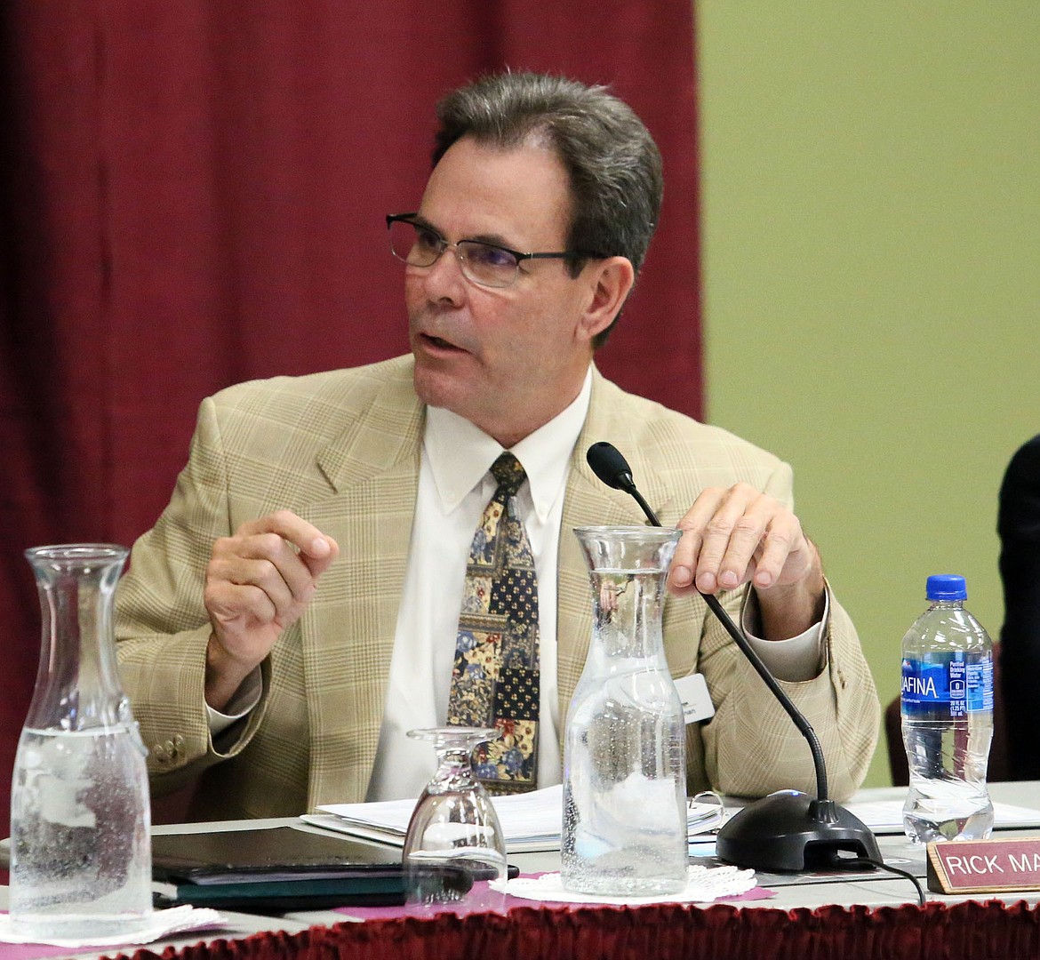 North Idaho College President Rick MacLennan discusses costs for scoping a possible future gymnasium and parking garage with the board of trustees Wednesday. (JUDD WILSON/Press)