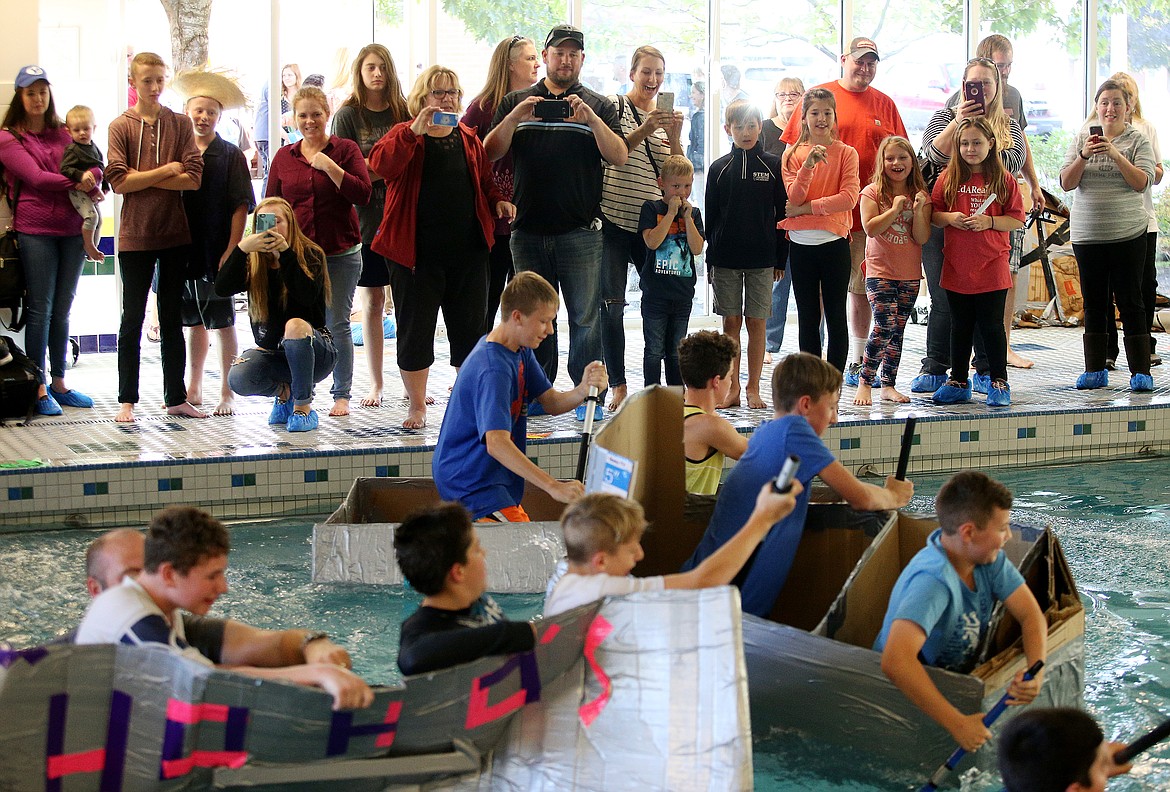 Parents, grandparents, friends and supporters cheer for competitors at the sixth annual Woodland Middle School cardboard boat race at Kootenai Health&#146;s McGrane Center pool on Wednesday. (LOREN BENOIT/Press)