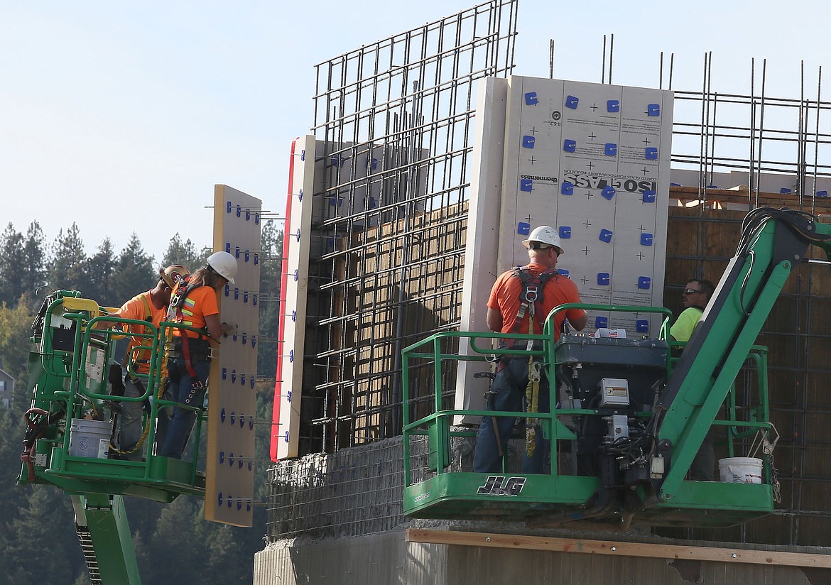 Workers put together the North Idaho Collaborative Education building on Thursday at North Idaho College. (JUDD WILSON/Press)