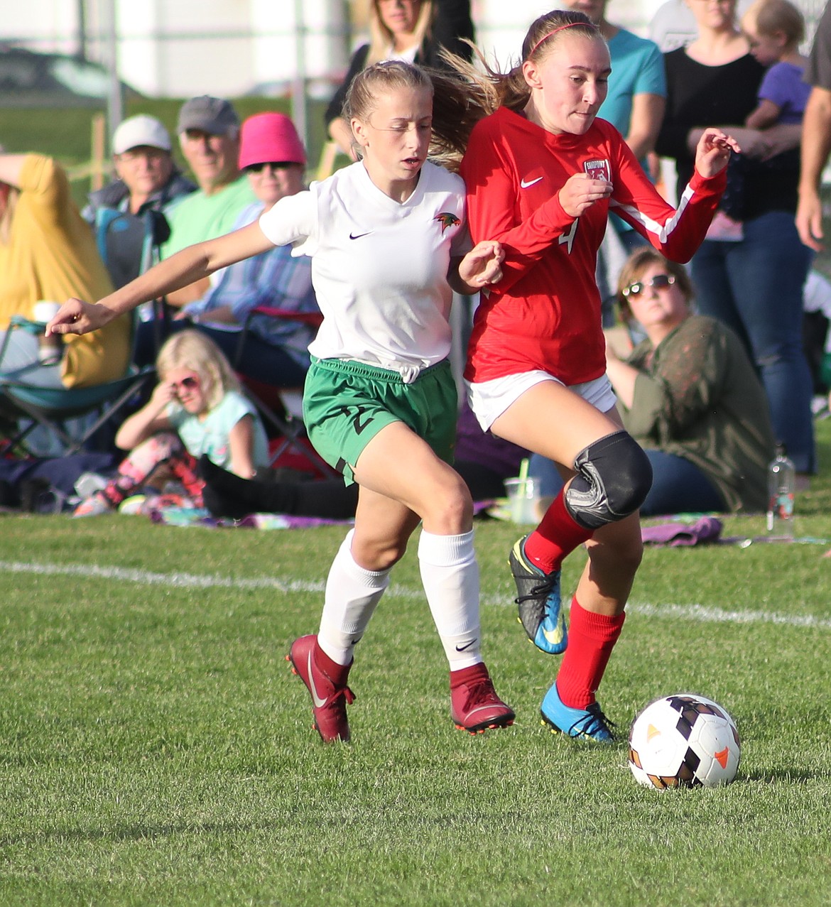 (Photo by ERIC PLUMMER)
Freshman Kate McGregor, right, battles for possession of the ball.