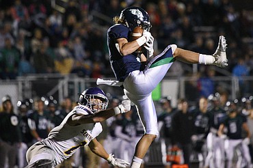 Glacier wide receiver Drew Deck (5) catches a 24-yard touchdown reception in the fourth quarter against Missoula Sentinel defensive back Rylan Ortt (2) to tie the game at 28-28 at Legends Stadium on Friday. (Casey Kreider/Daily Inter Lake)