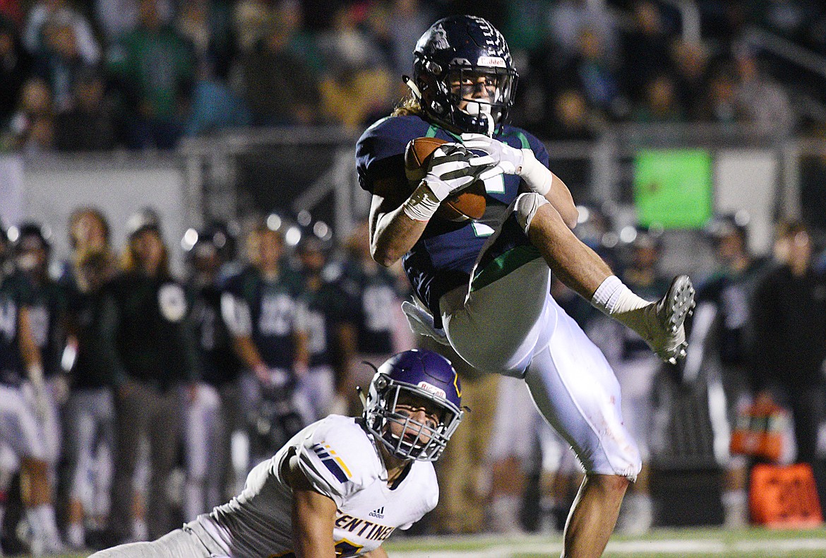 Glacier wide receiver Drew Deck (5) catches a 24-yard touchdown reception in the fourth quarter against Missoula Sentinel defensive back Rylan Ortt (2) to tie the game at 28-28 at Legends Stadium on Friday. (Casey Kreider/Daily Inter Lake)