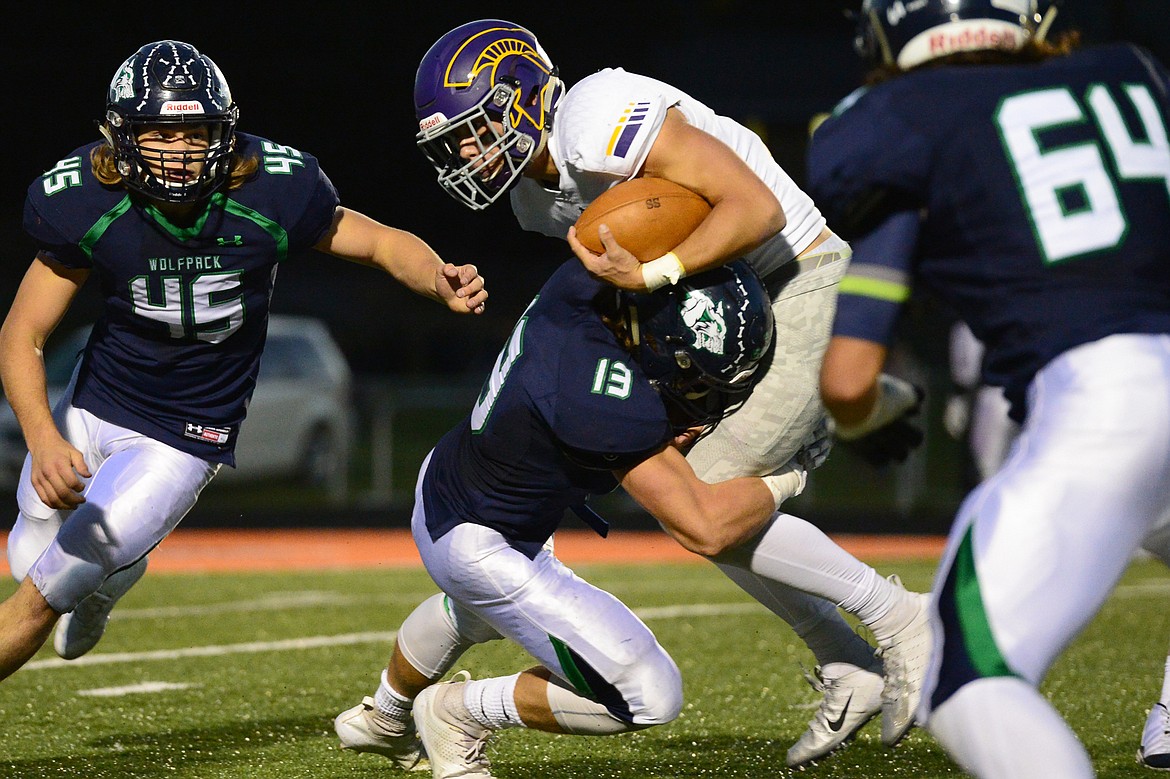 Missoula Sentinel quarterback Rylan Ortt (2) is tackled by Glacier linebacker Cole Crosby (13) on a first half run at Legends Stadium on Friday. (Casey Kreider/Daily Inter Lake)