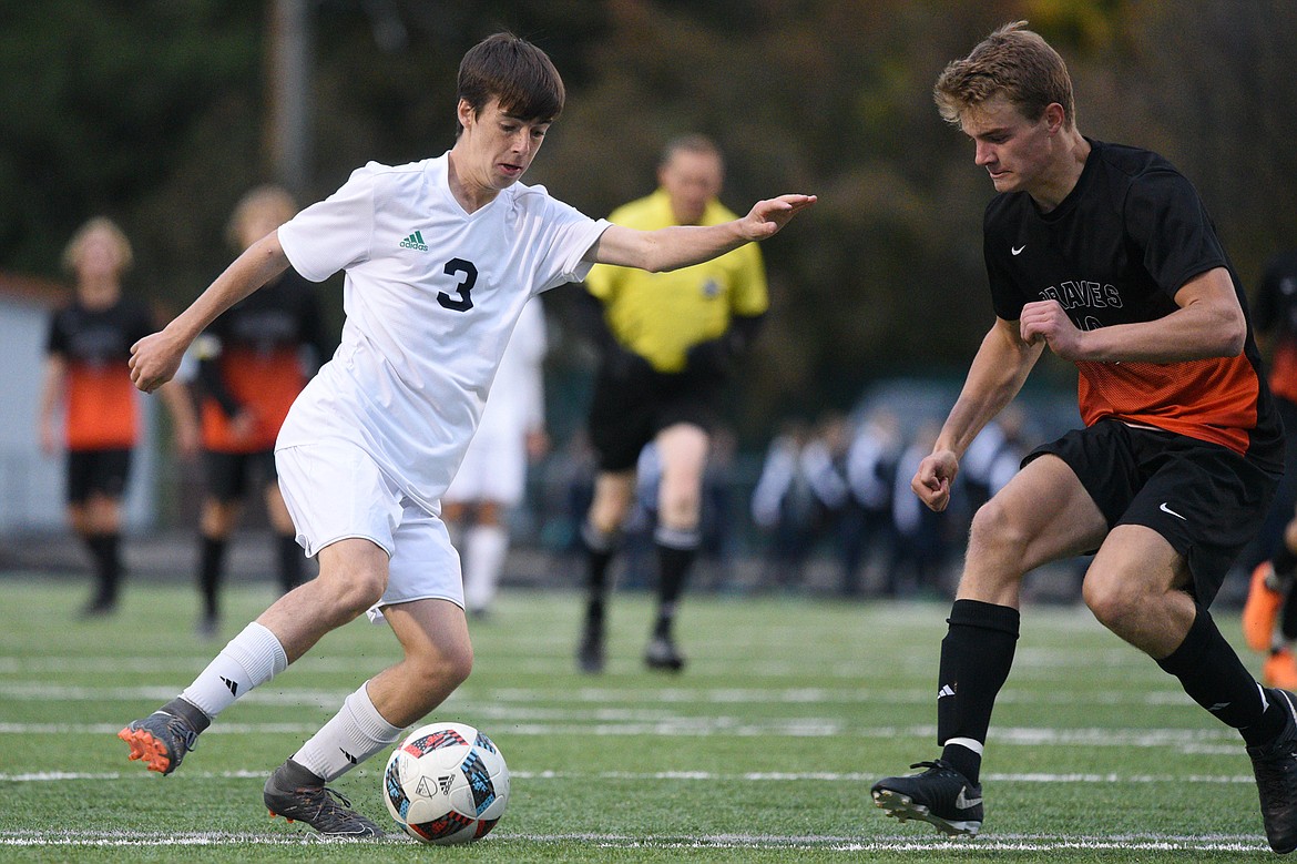 Glacier's Zane Elliott (3) tries to get past Flathead's Camas Rinehart (16) during a crosstown matchup at Legends Stadium on Thursday. (Casey Kreider/Daily Inter Lake)