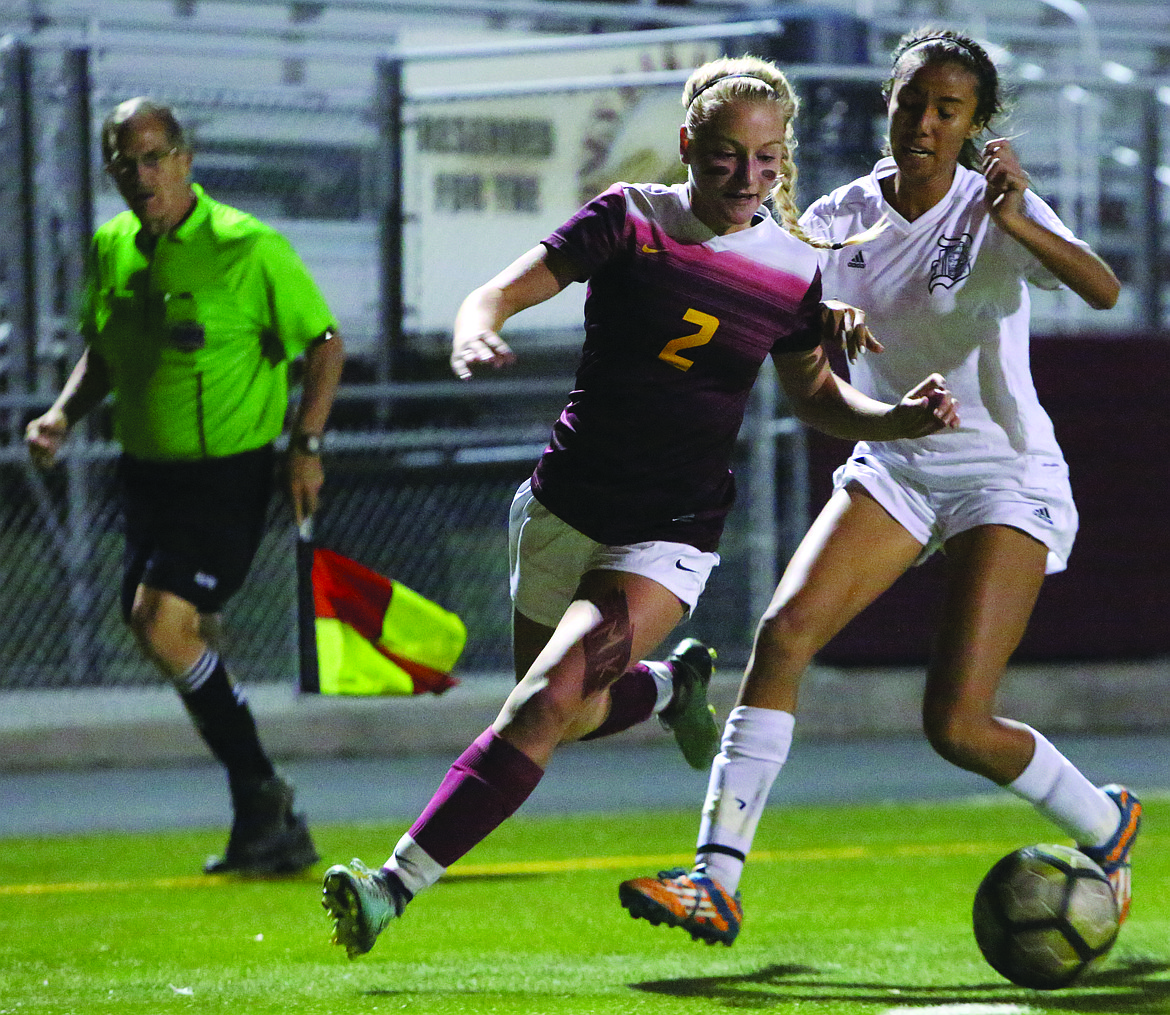 Connor Vanderweyst/Columbia Basin Herald
Moses Lake forward Madi Krogh (2) tries to gain possession from a Davis defender.