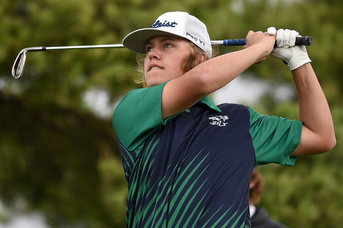 Glacier's Keaton Cassidy watches his tee shot on the fourth hole during the Crosstown Cup at Village Greens Golf Club on Thursday. (Casey Kreider/Daily Inter Lake)