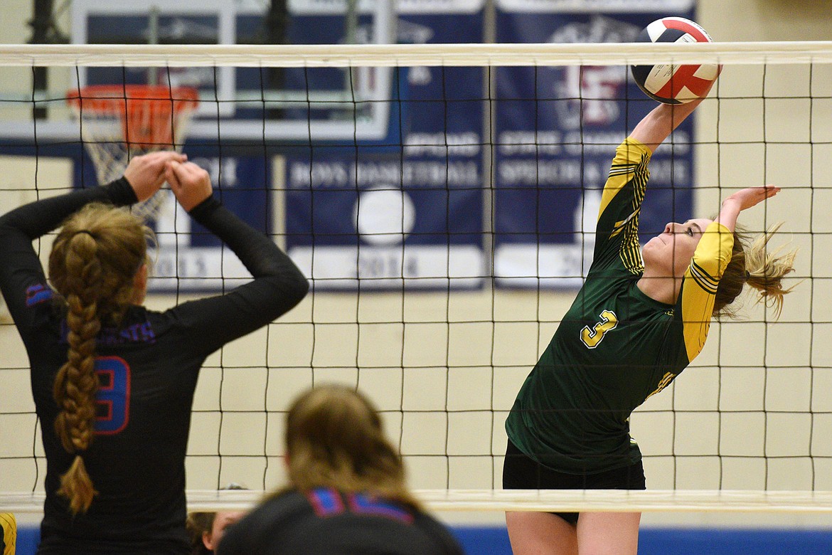 Whitefish's Kennedy Grove (3) looks for a kill against Columbia Falls' Hannah Schweikert (9) at Columbia Falls High School on Tuesday. (Casey Kreider/Daily Inter Lake)