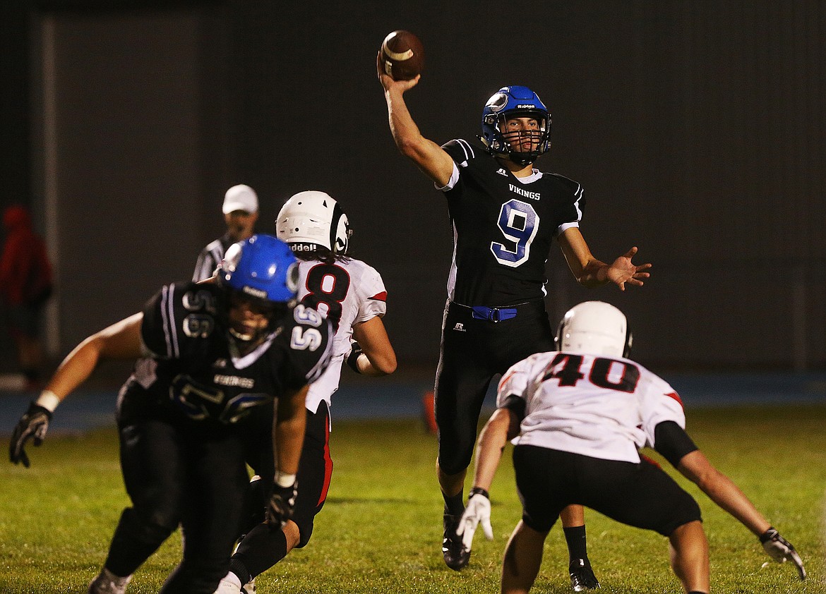 Coeur d&#146;Alene High quarterback Kale Edwards throws the ball downfield against Highland in Friday night&#146;s game at Coeur d&#146;Alene High. (LOREN BENOIT/Press)