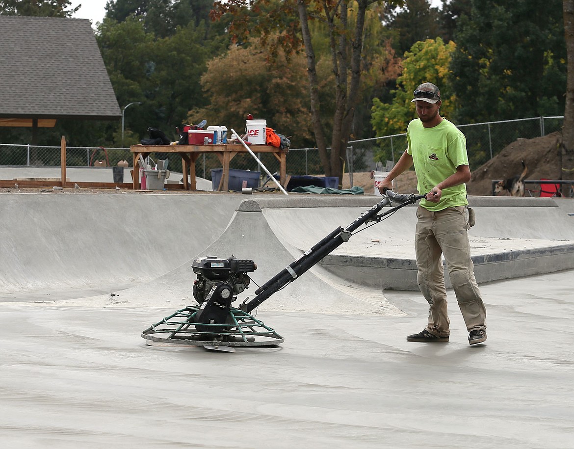 JUDD WILSON/Press
Richie Conklin of Evergreen Skateparks works on concrete at the new Coeur d&#146;Alene Skate Park on Friday.
