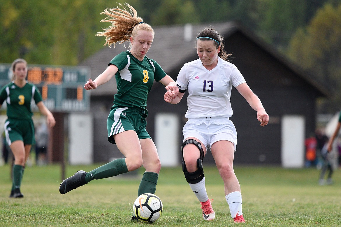 Whitefish's Abigail Shaffer works the ball upfield against Polson's Ashlee Howell at Smith Fields on Saturday. (Casey Kreider/Daily Inter Lake)