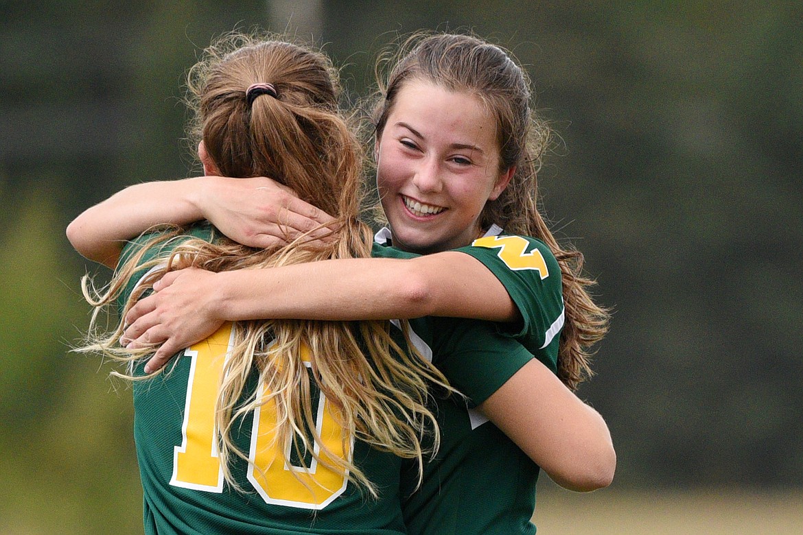 Whitefish&#146;s Ali Hirsch (10) and Grace Benkelman (3) celebrate after Hirsch&#146;s goal in the first half against Polson at Smith Fields in Whitefish on Saturday. (Casey Kreider/Daily Inter Lake)