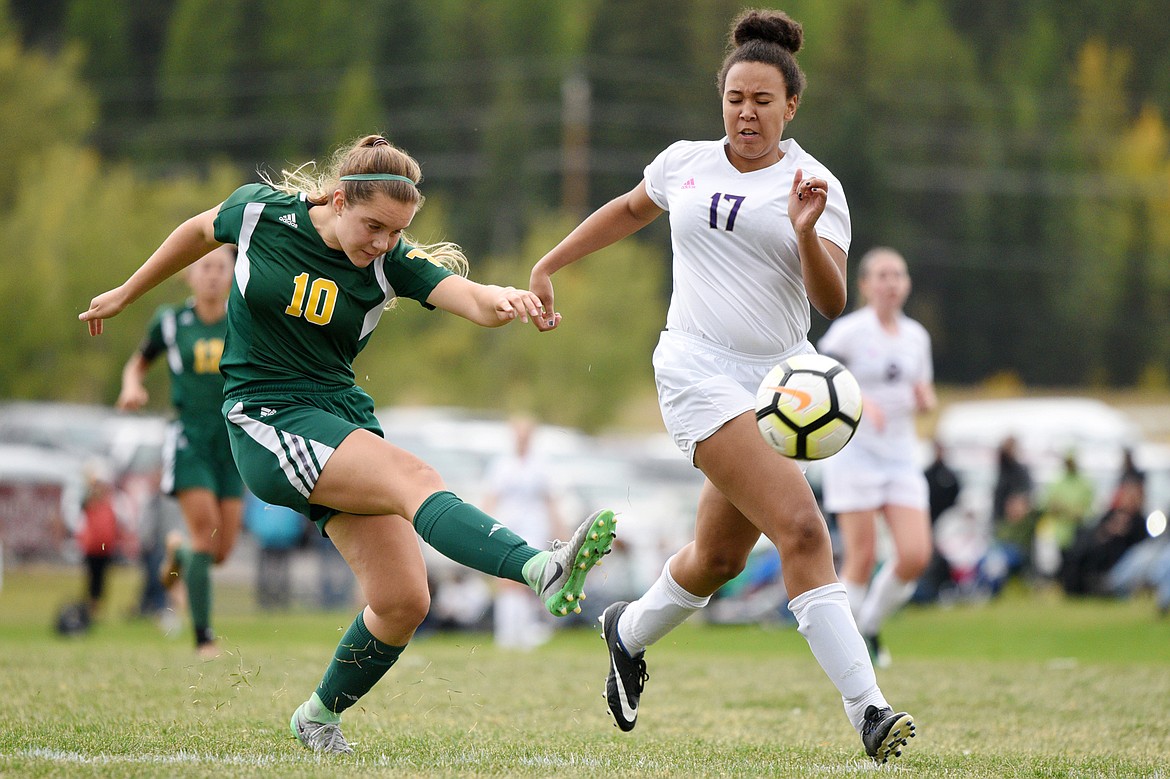 Whitefish's Ali Hirsch scores a first half goal in front of Polson defender Micaela Redwine at Smith Fields in Whitefish on Saturday. (Casey Kreider/Daily Inter Lake)