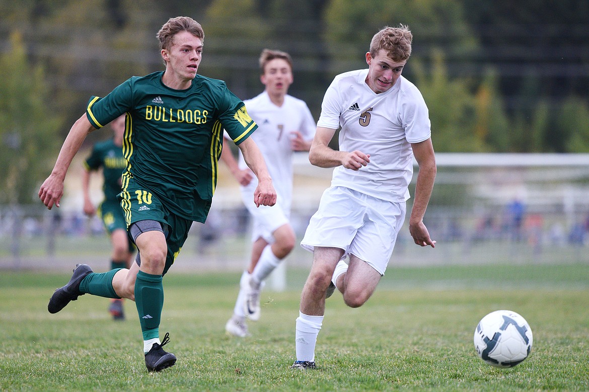 Whitefish's Casey Schneider (10) pushes the ball upfield past Polson defender Keyan Dalbey (5) at Smith Fields in Whitefish on Saturday. (Casey Kreider/Daily Inter Lake)