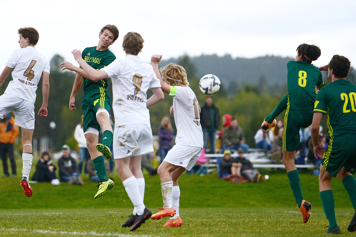 Whitefish's Brandon Mendoza (8) scores a goal off a corner kick by Casey Schneider (10) that was redirected by a header by the Bulldogs' Joseph Houston (15) in the second half against Polson at Smith Fields on Saturday. (Casey Kreider/Daily Inter Lake)