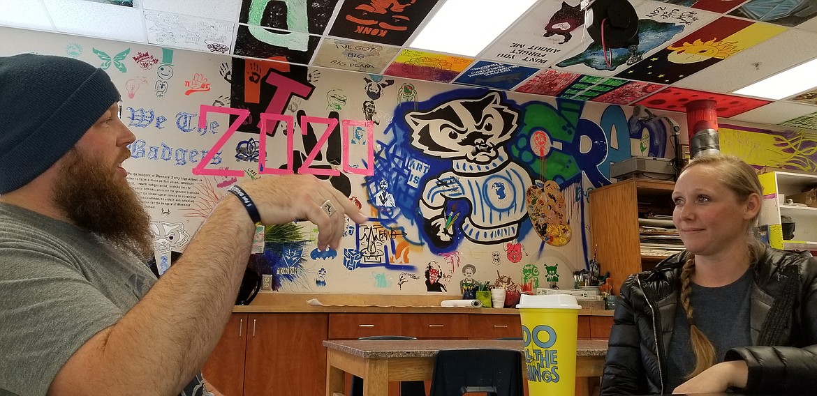 Photo by MANDI BATEMAN
Artists Josh and Sara Knaggs in the BFHS art room, decorated by student work.