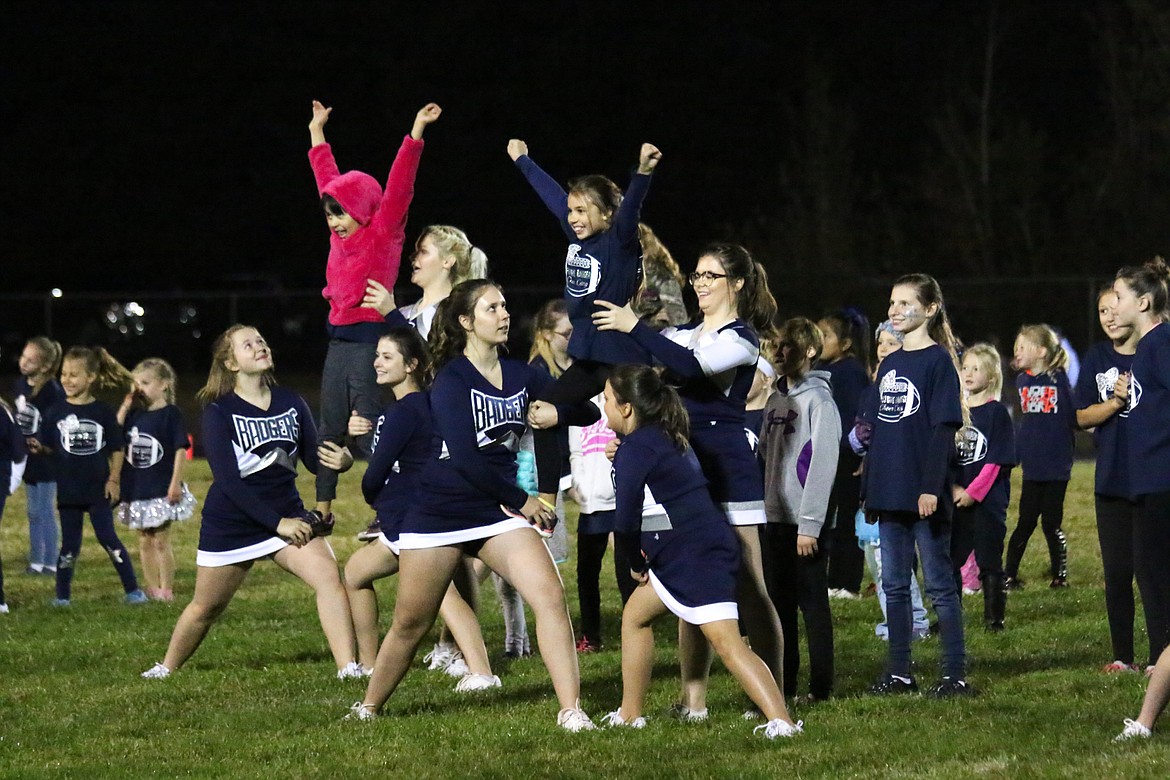 Photo by MANDI BATEMAN
Over 40 future cheerleaders took to the field under the mentorship of the older cheerleaders from the high school and middle school.