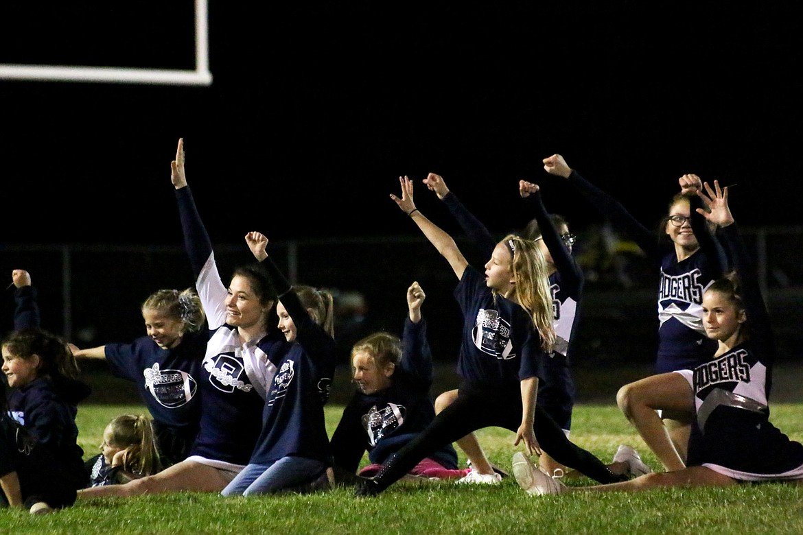 Badger cheerleaders, present and future, come together for a Sept. 21 halftime performance.