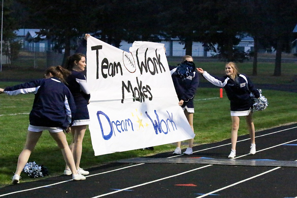 The cheerleaders prepare for the Badger football players to make their grand entrance at Friday&#146;s game against Moscow.