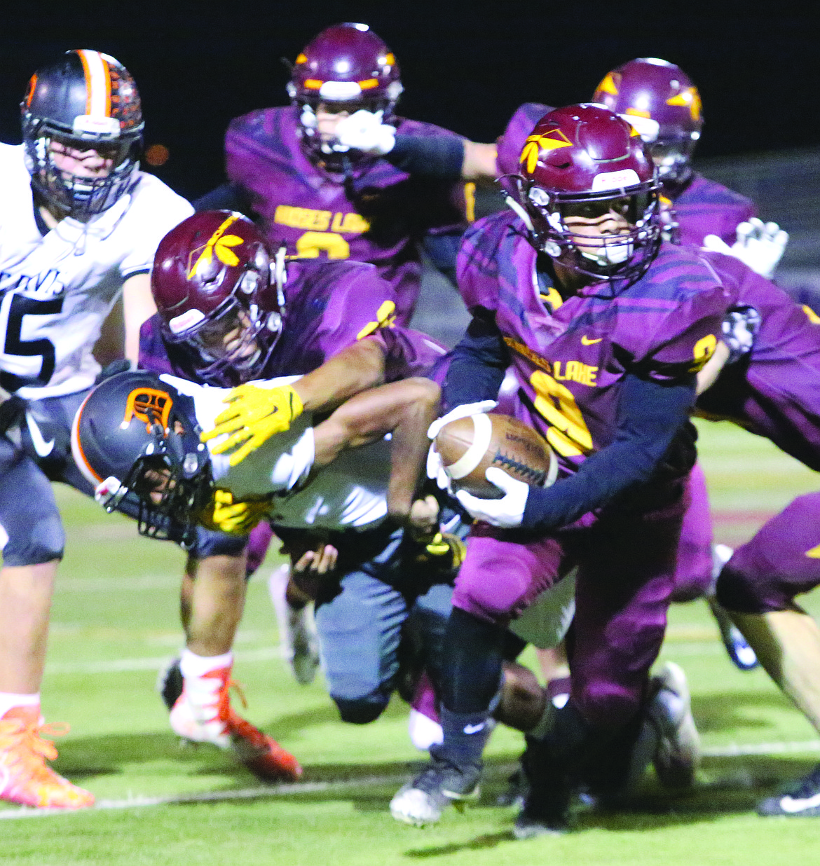 Connor Vanderweyst/Columbia Basin Herald
Moses Lake defensive back Lerenz Thomas (9) rips the ball from Davis running back Dimitri Rodriguez on his way to a touchdown.