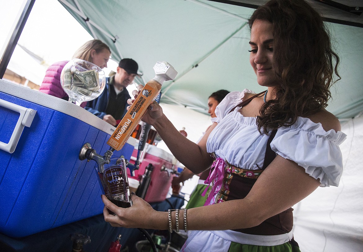 LOREN BENOIT/Press File
Laurel Moore pours an Imperial pumpkin porter for a customer during the Downtown Coeur d&#146;Alene Oktoberfest 2016. This year&#146;s celebration will be from 4 to 9 p.m. Friday and from noon to 9 p.m. Saturday.