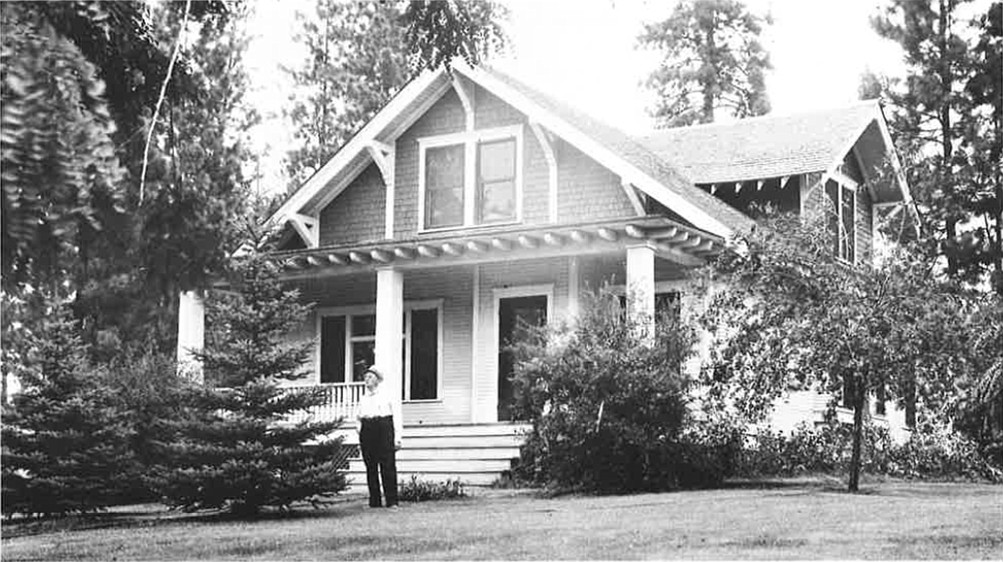 Rev. C.S. Thompson of Coeur d&#146;Alene Homes stands in front of the &#147;White House&#148; in this circa 1940s photo. The house, built in 1903, was rescued from demolition by long-time Coeur d&#146;Alene resident and businessman John Swallow, who worked for a year with several people and entities to move the house to his Casco Bay property via lake barge. The house made its voyage across Lake Coeur d&#146;Alene on Thursday and arrived just fine. (Courtesy photo)