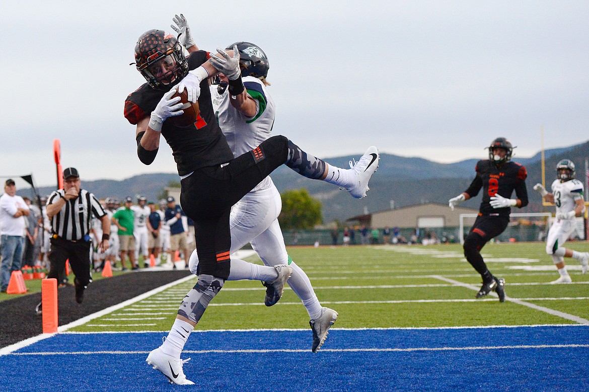 Flathead wide receiver Logan Siblerud (1) hauls in a first quarter touchdown pass over Glacier defensive back Casey Peiffer (21) at Legends Stadium on Friday. (Casey Kreider/Daily Inter Lake)