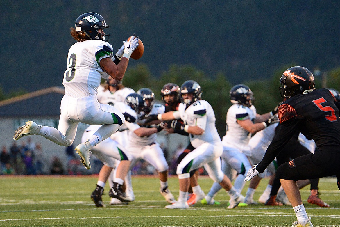 Glacier wide receiver Danny Anderson (3) catches a pass across the middle in the first half against Flathead at Legends Stadium on Friday. (Casey Kreider/Daily Inter Lake)