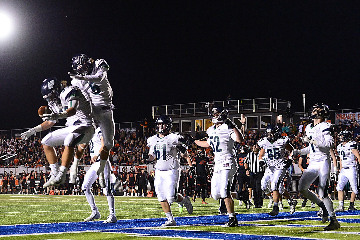 Glacier's Preston Blain (33) and Drew Deck (5) celebrate after a fourth quarter touchdown run by Blain against Flathead at Legends Stadium on Friday. (Casey Kreider/Daily Inter Lake)