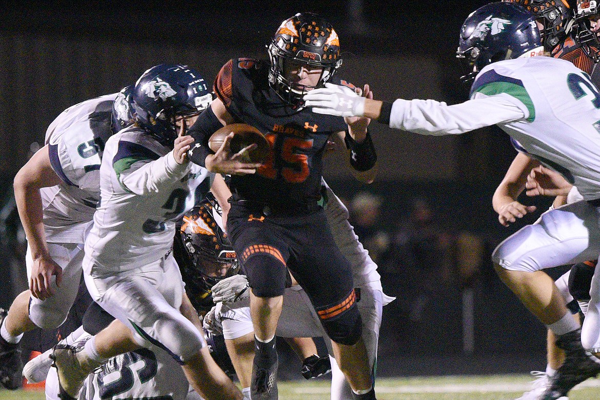 Flathead quarterback Jaden MacNeil (15) breaks free for a 36-yard touchdown run in the third quarter of a crosstown matchup with Glacier at Legends Stadium on Friday. (Casey Kreider/Daily Inter Lake)