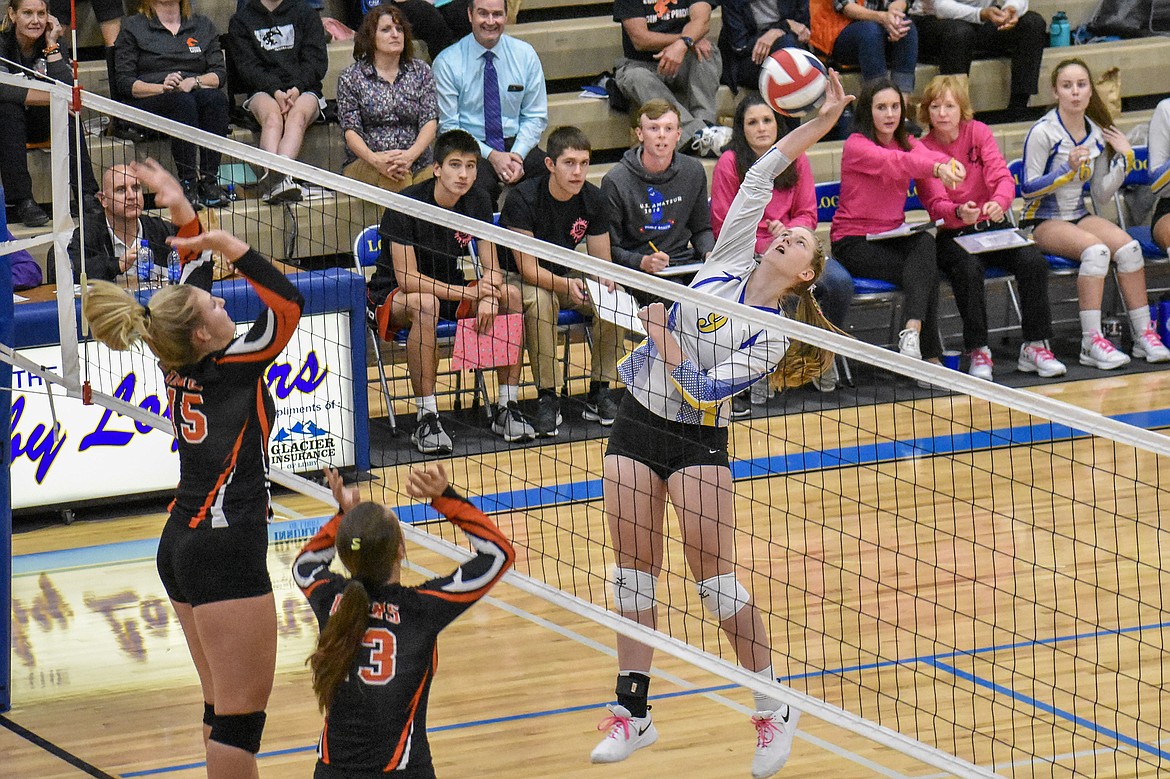 Libby senior Jayden Winslow gets a kill in the second set of the Lady Loggers&#146; three-set win against the Eureka Lady Lions during the Battle of the Kootenai match Tuesday. (Ben Kibbey/The Western News)