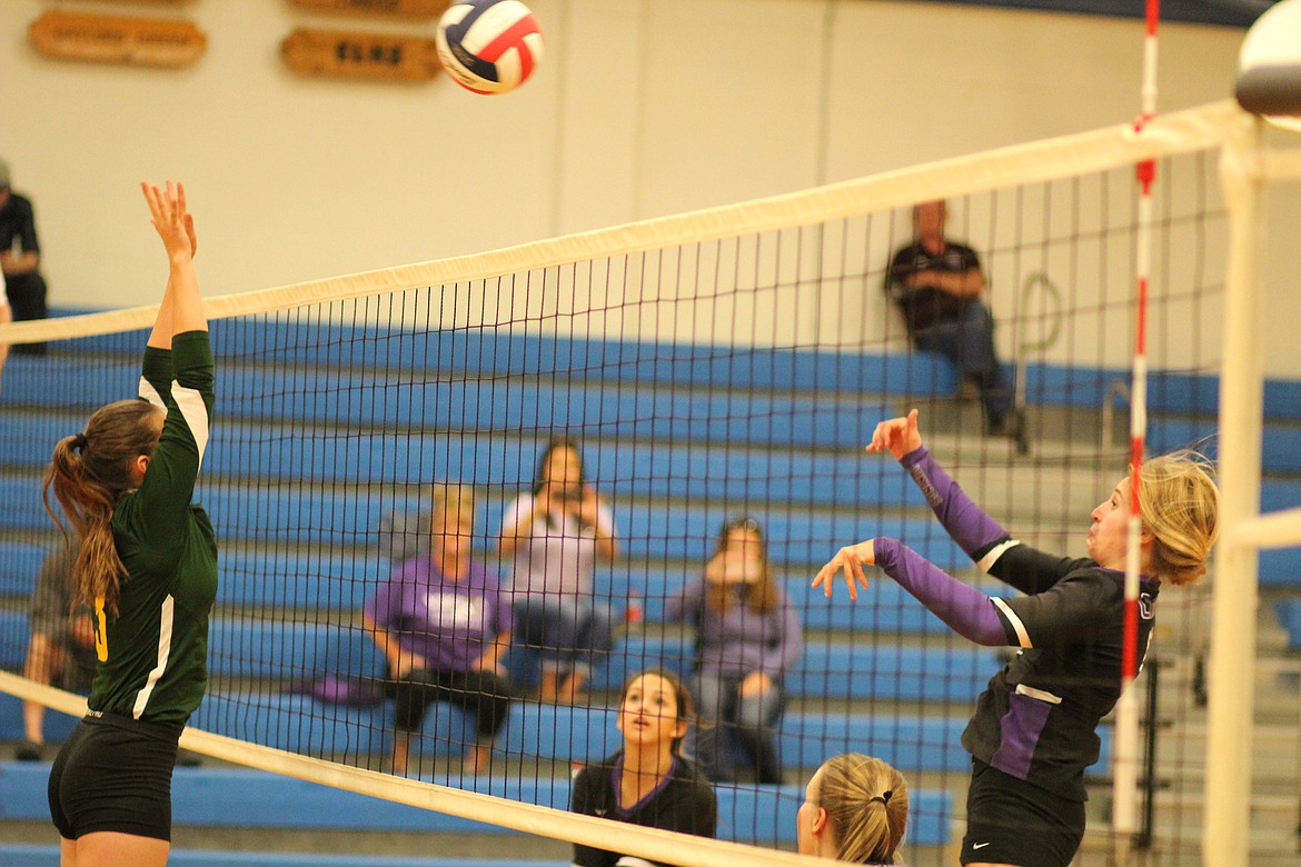 A Charlo hitter sends the ball over an attempted block during the Lady Vikings' match against Lincoln in the Mineral County Shootout.