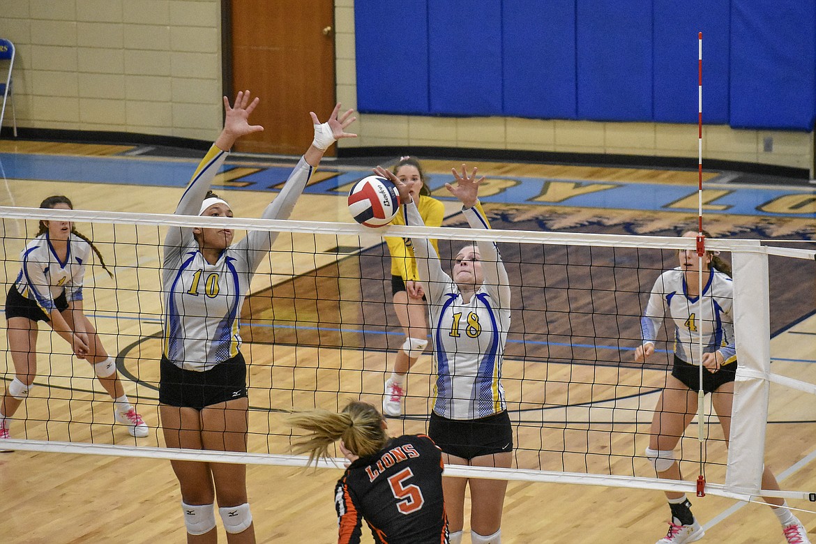 Libby senior Jessika Jones makes a block to tie the set score 2-2 early in the second set of the Battle of the Kootenai. (Ben Kibbey/The Western News)