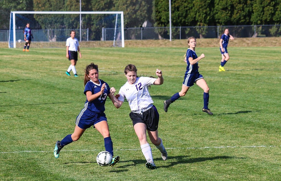 Sophomore Makayla Mierke fights off a KHS player.