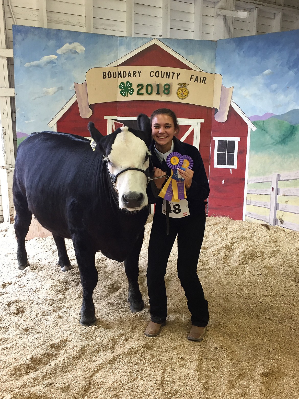 Sydney Nelson with her Grand Champion ribbon in Beef Showmanship.