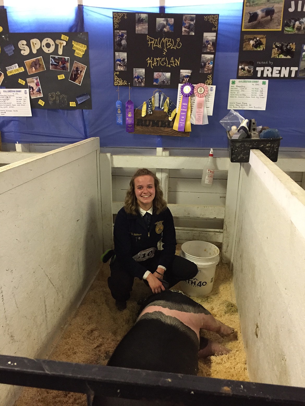 (Courtesy Photo)
Katelyn Hutchinson with her pig, Rumble, and her Reserve Champion ribbon in Swine Showmanship.