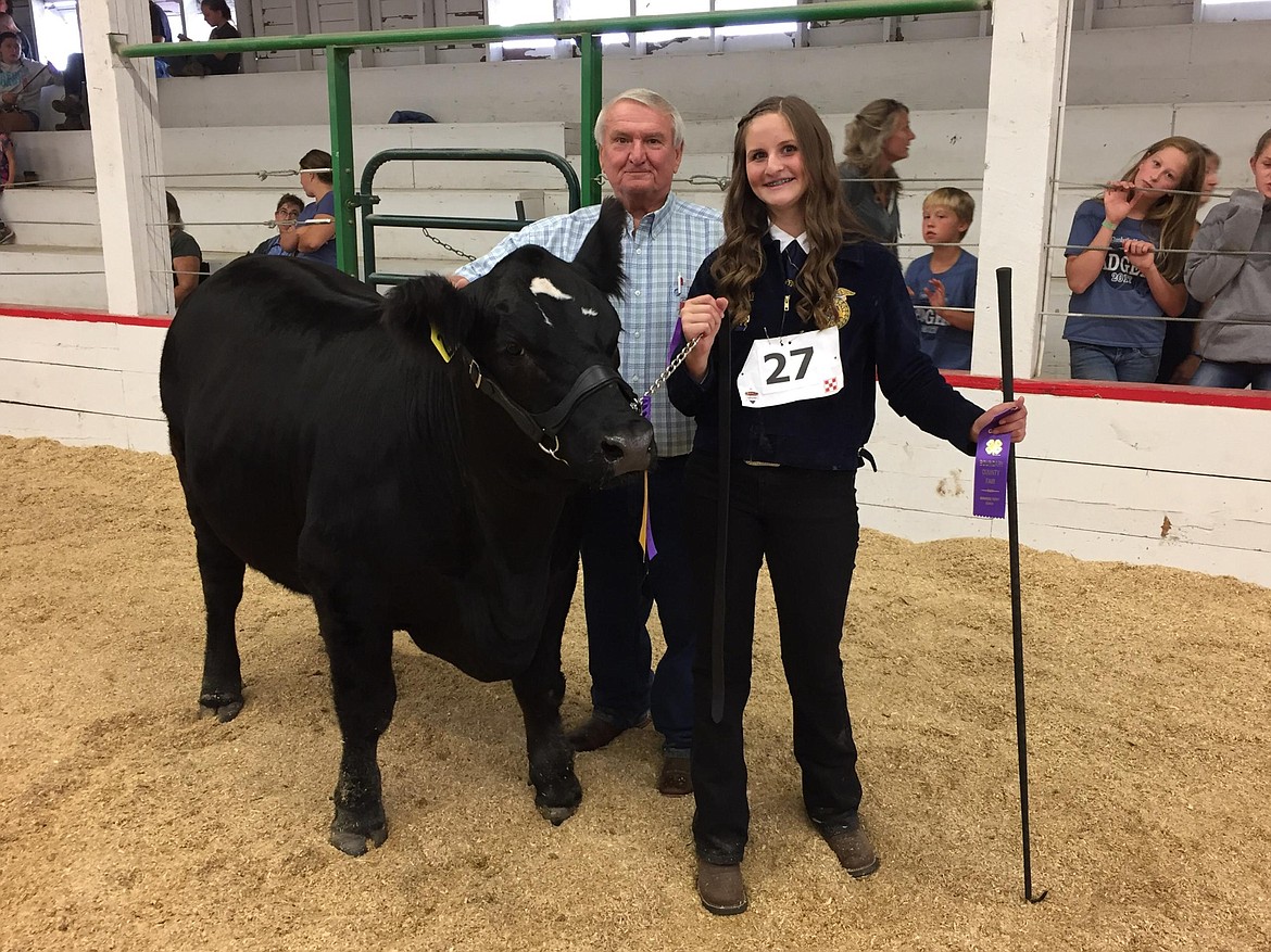 Sierra Hill with her Grand Champion Quality steer, Moose.