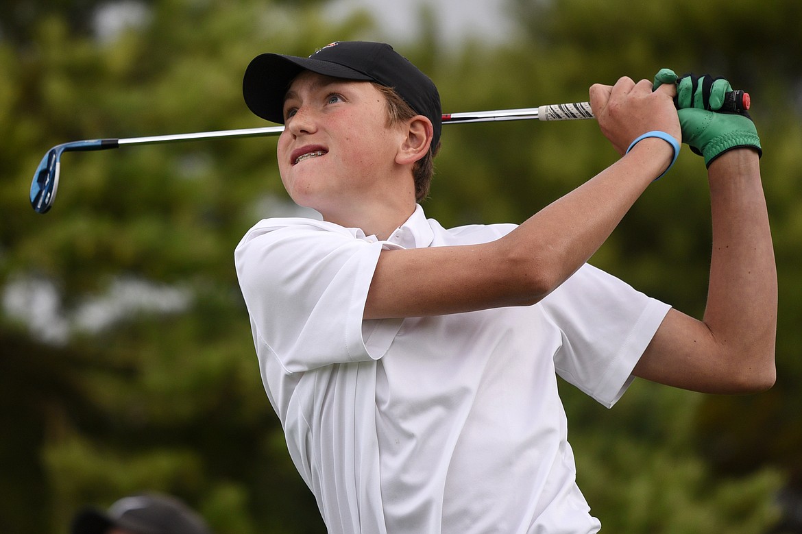 Flathead's Ezra Epperly watches his tee shot on the fourth hole during the Crosstown Cup at Village Greens Golf Club on Thursday. (Casey Kreider/Daily Inter Lake)