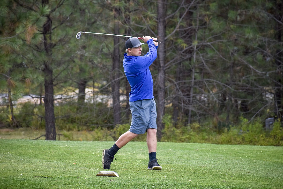 Libby senior Andrew Freese tees off on the 9th hole during the Western &#145;A&#146; Divisional at Cabinet View Golf Club in Libby Friday. (Ben Kibbey/The Western News)