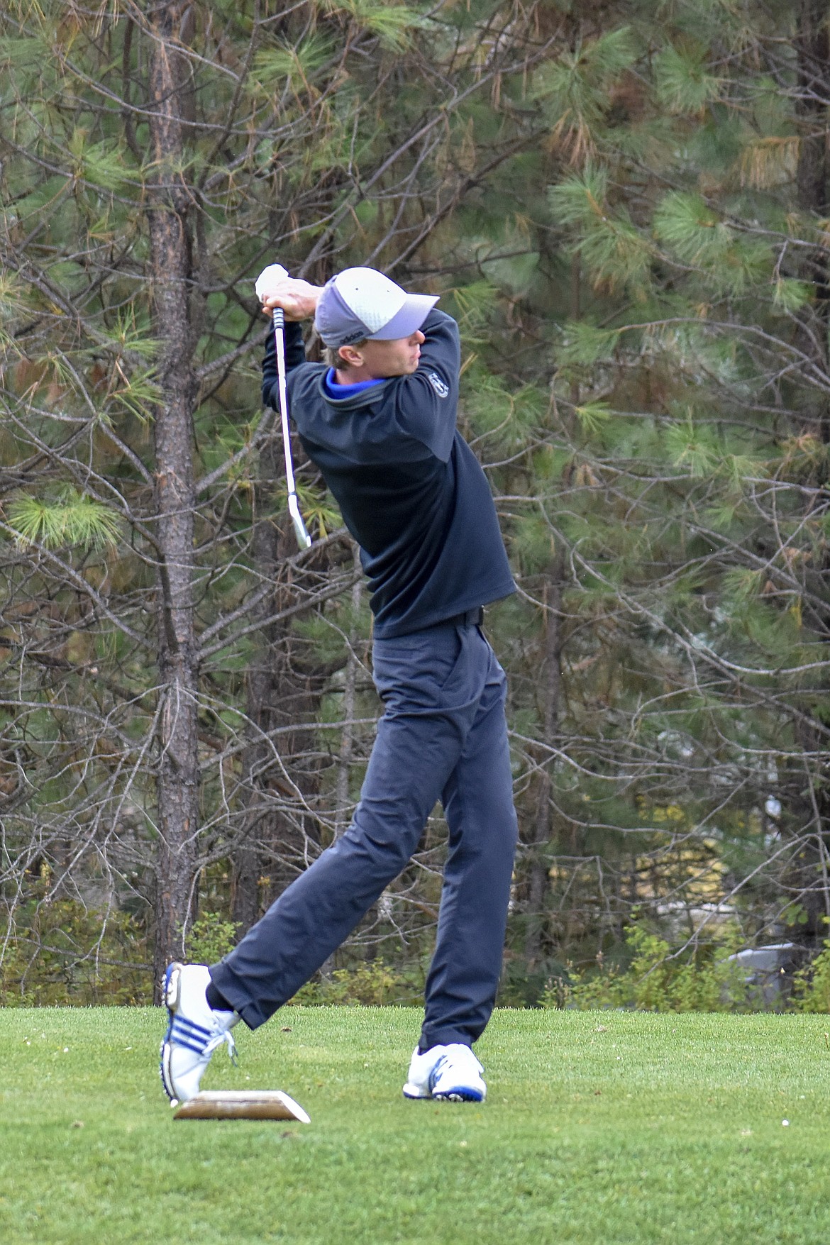 Libby senior Ryggs Johnston tees off on the 9th hole during the Western &#145;A&#146; Divisional at Cabinet View Golf Club in Libby Friday. (Ben Kibbey/The Western News)