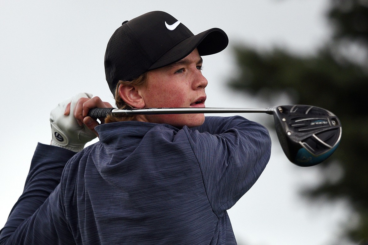 Glacier's Will Salonen watches his tee shot on the third hole during the Crosstown Cup at Village Greens Golf Club on Thursday. (Casey Kreider/Daily Inter Lake)