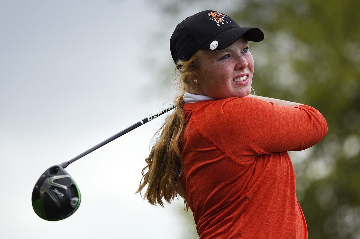Flathead's Marcela Mercer watches her tee shot on the first hole during the Crosstown Cup at Village Greens Golf Club on Thursday. (Casey Kreider/Daily Inter Lake)
