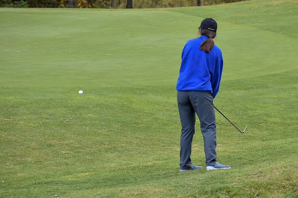 Libby sophomore Kayley Svendsbye chips onto the green on the 9th hole during the Western &#145;A&#146; Divisional at Cabinet View Golf Club in Libby Friday. (Ben Kibbey/The Western News)