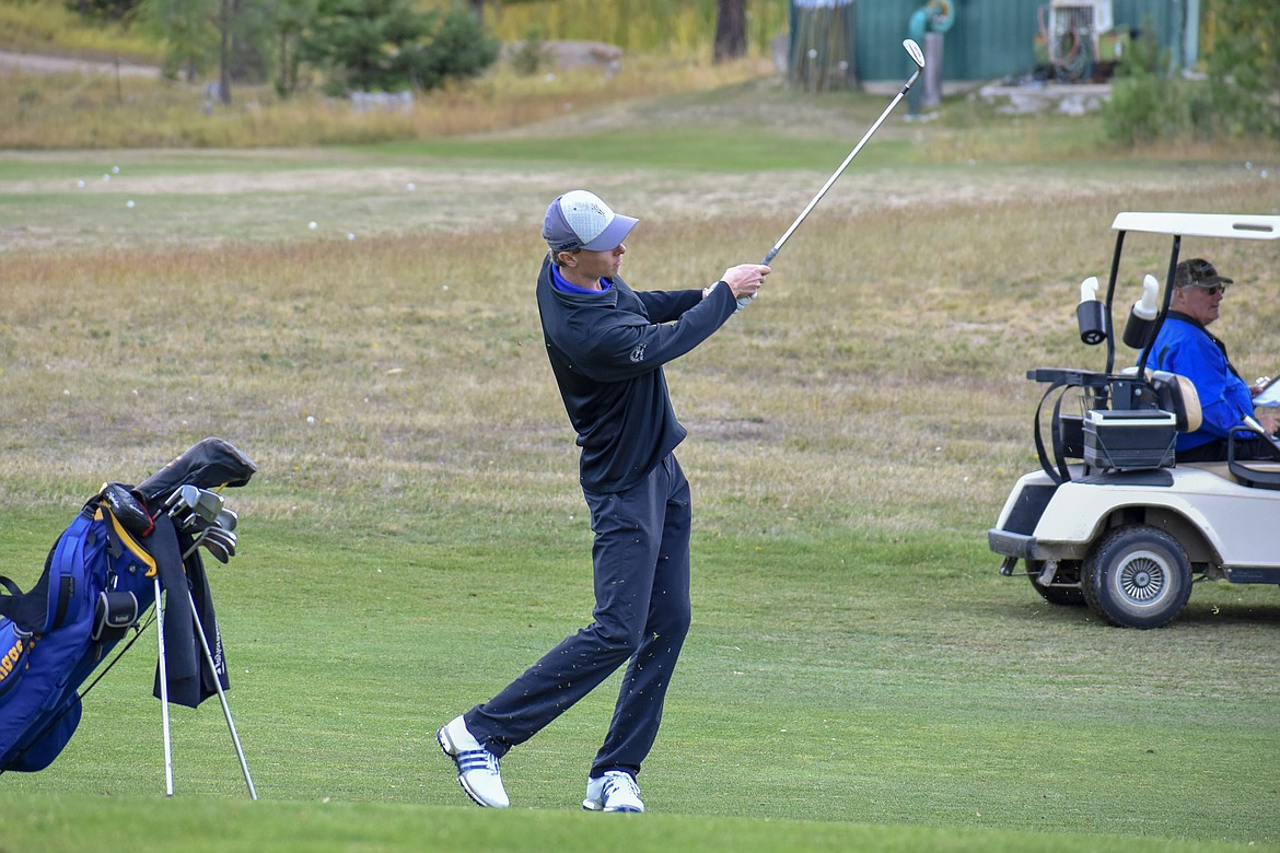 Libby senior Ryggs Johnston drives onto the green on the 9th hole during the Western &#145;A&#146; Divisional at Cabinet View Golf Club in Libby Friday. (Ben Kibbey/The Western News)