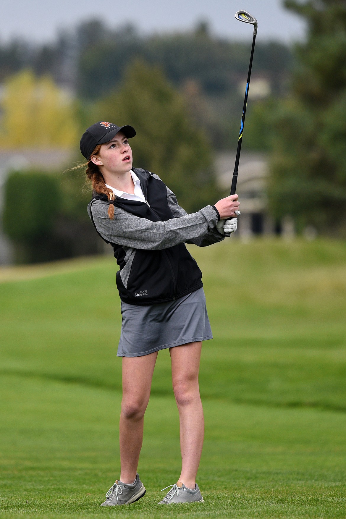 Flathead's Jillian Wynne watches her approach on the first fairway during the Crosstown Cup at Village Greens Golf Club on Thursday. (Casey Kreider/Daily Inter Lake)