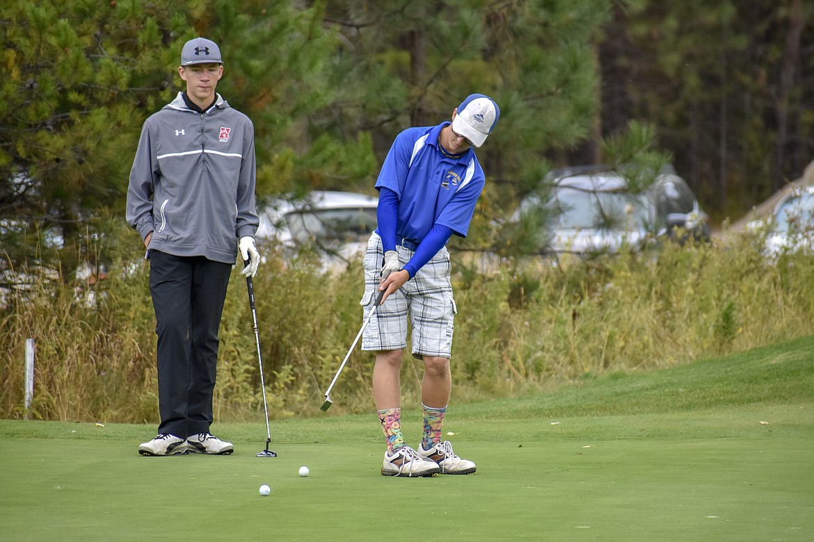 Libby freshman Landon Haddock putts on the 17th hole during the Western &#145;A&#146; Divisional at Cabinet View Golf Club in Libby Friday. (Ben Kibbey/The Western News)