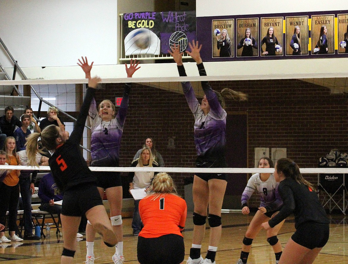 Photo by JOSH McDONALD
Kellogg freshmen duo Grace Nearing and Hailey Cheney attempt to block a Priest River attack during their Intermountain League match last week.